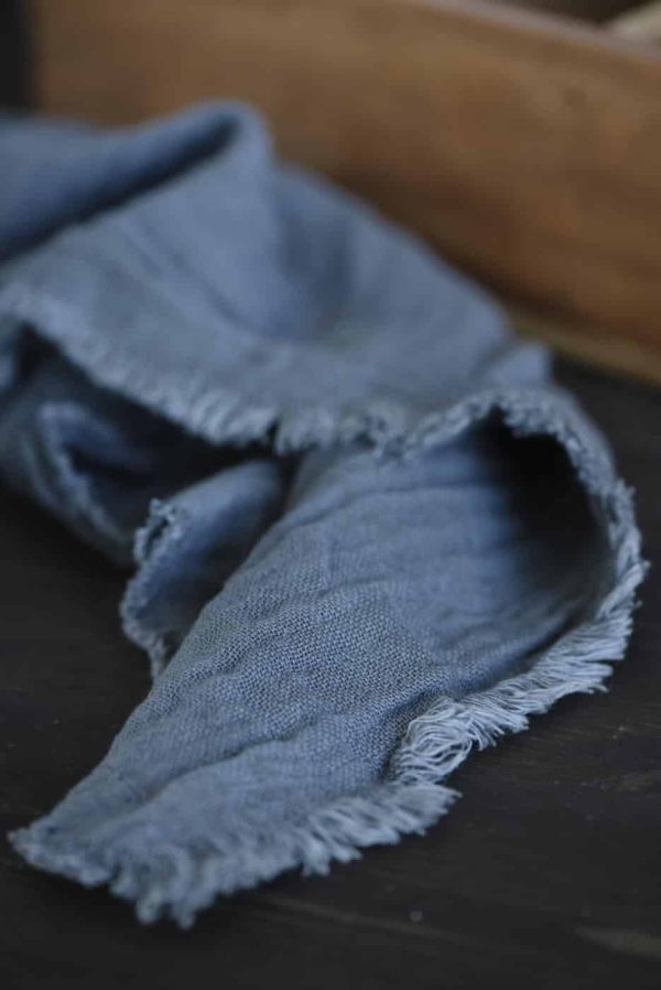 Blå stofserviet med fryns